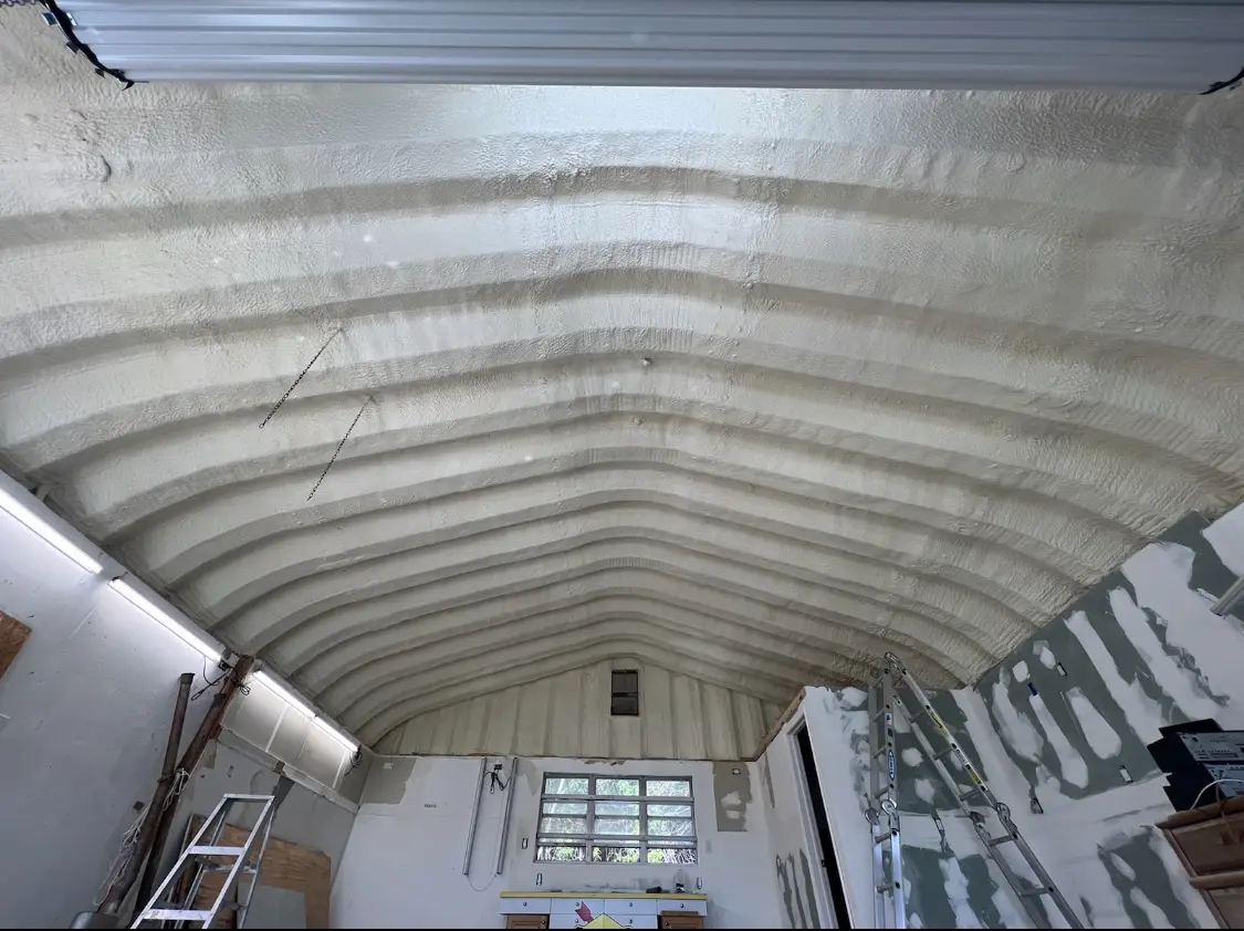 Spray polyurethane foam applied to the underside of a metal roof deck in Blooming Grove